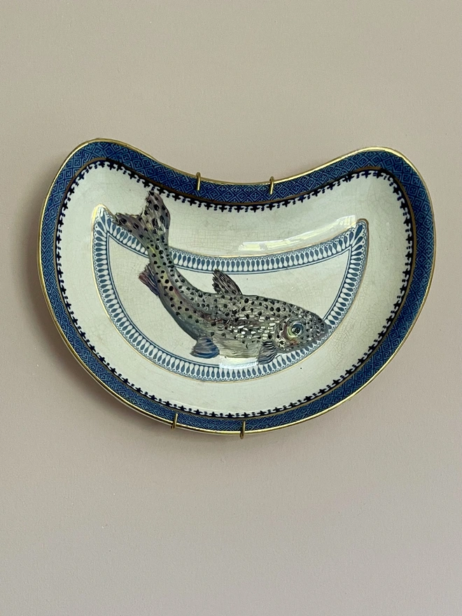 trout painting on plate