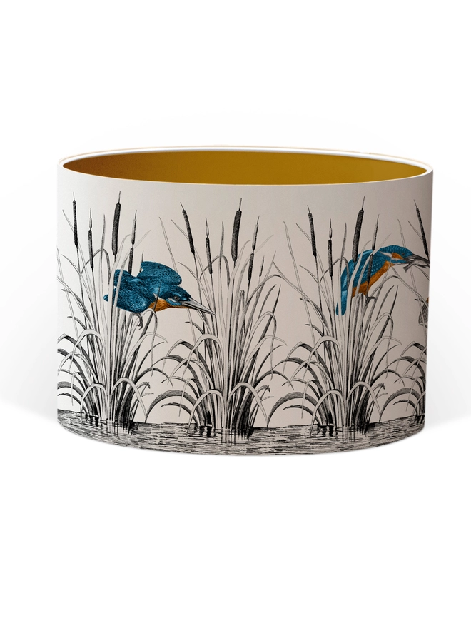 Handmade lampshade featuring vibrant kingfishers among bulrushes in a whimsical countryside-inspired design, combining nature, colour, and artisan style.