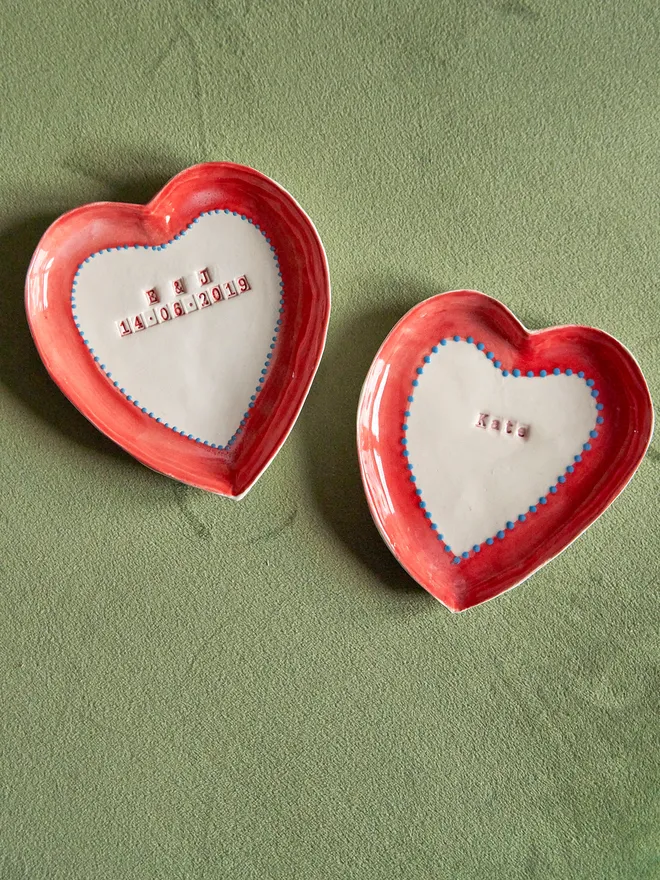 Personalised ceramic heart trinket dish. Two ceramic heart trinket dishes with a name and a initials and a date stamped in the middle.