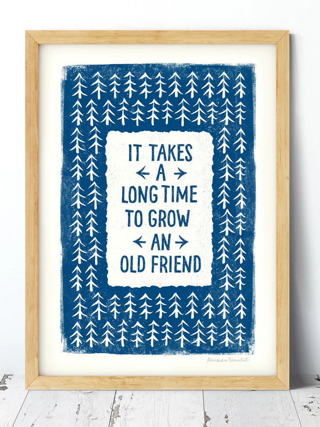 Blue friendship gift print with friendship quote in wood frame on white wood floor
