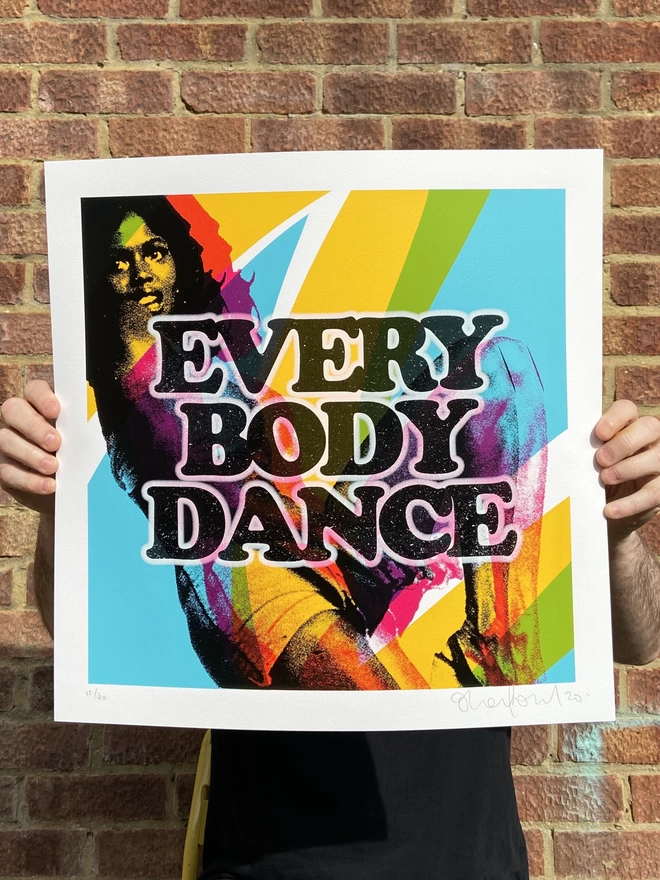 Vibrant "Everybody Dance" Hand Pulled Screen Print  square with lady in back ground dancing amongst different shade of colour blue back ground and the words everybody dance printed on top "Everybody Dance" screenprint with colorful dancing silhouettes and bold typography, exuding energy and movement.