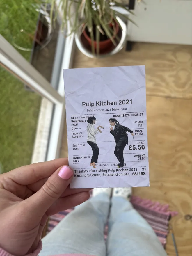 Pulp Kitchen Print, against a wooden floor background. 