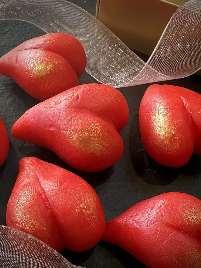 Marzihearts Valentines Chocolates (Box Of 6, 9, 12), cherry valentines heart chocolates grouped together on a black surface. 