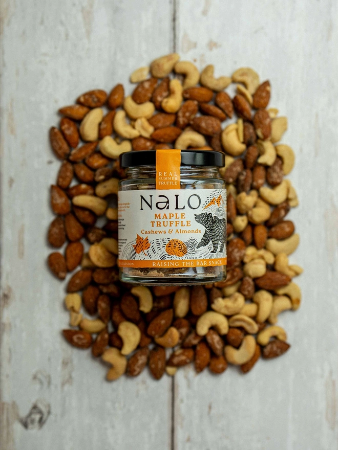 Maple Truffle Cashews & Almonds (Set Of 6), on a wooden background, surrounded with nuts, 