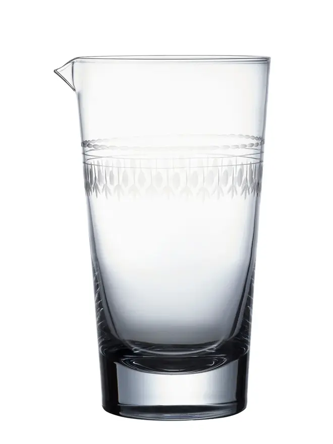 engraved ovals crystal mixing glass. a cocktail glass with an engraved oval pattern.