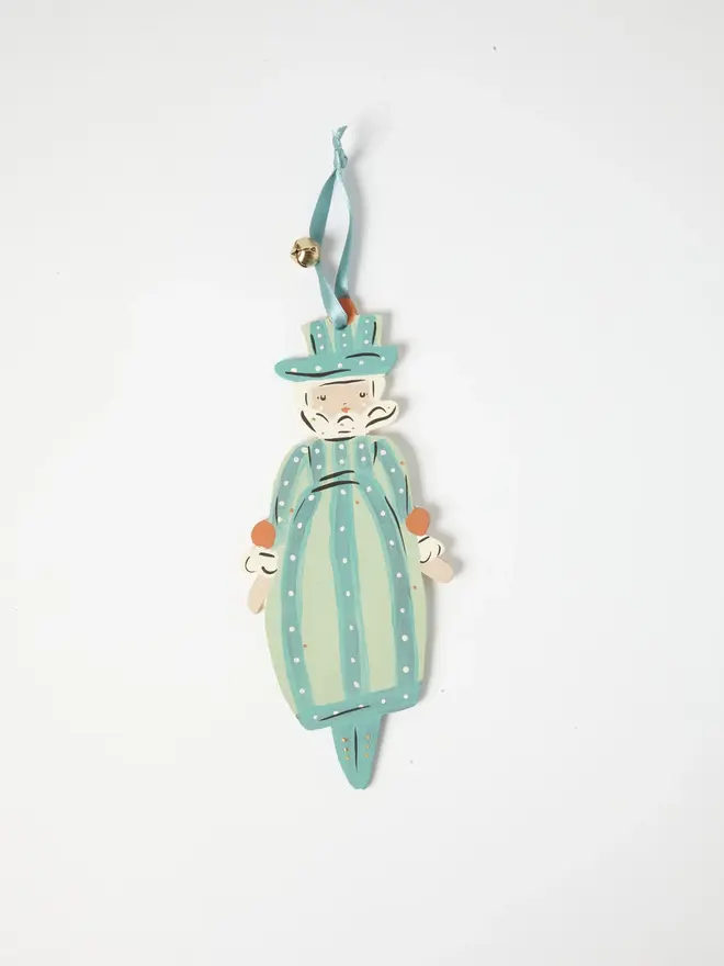 Miss Christmas Tree Dancer. a flat lay product shot of the miss christmas tree dancer hanging ornament on a plain white background, showing a bearded figure in a striped teal and cream costume with polka dots, topped with a matching striped hat. the figure hangs from a teal ribbon with a small gold bell attached, and its shape tapers to a pointed base like a tree topper. hand-painted details in orange and cream give the ornament a folk-art, storybook charm.