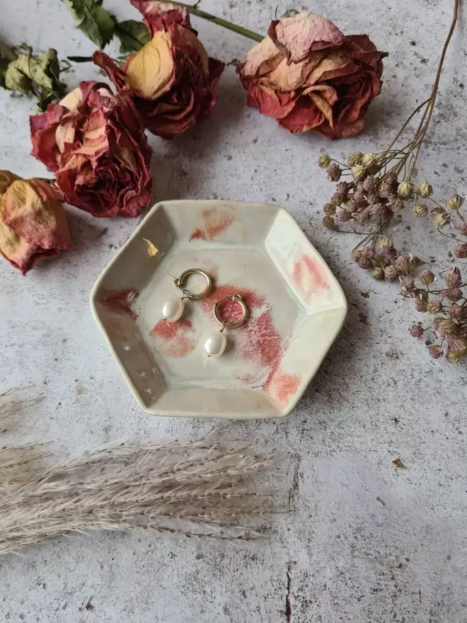 Mini Hexagon Trinket Jewellery Ring dish, ceramic dish, pottery dish, gift, homeware, Jenny Hopps Pottery Photographed on a mottled white backdrop with dried flowers and earrings, cream, white and pink