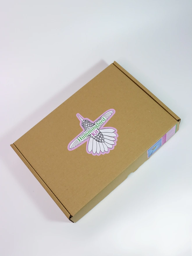 Paper hummingbird kit box from above