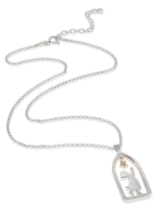 Flat lay product image of silver chain and pendant. Pendant frames sillouhette of child in archway reaching towards a hanging golden star. 