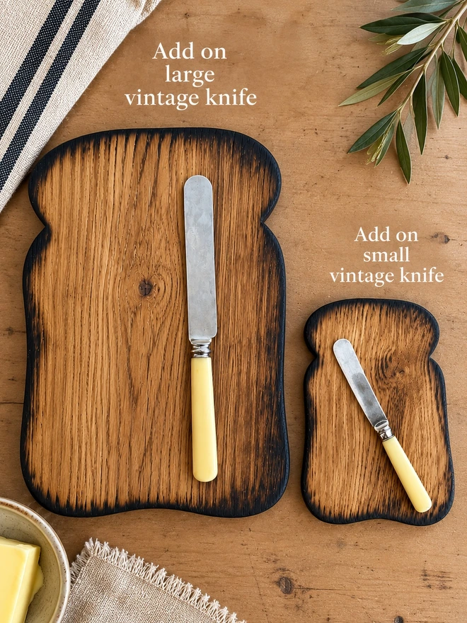 Large and small toast boards with large and small vintage knives with cream handle 