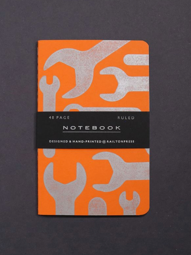 Lined Spanner Pocket Notebook. A notebook in orange