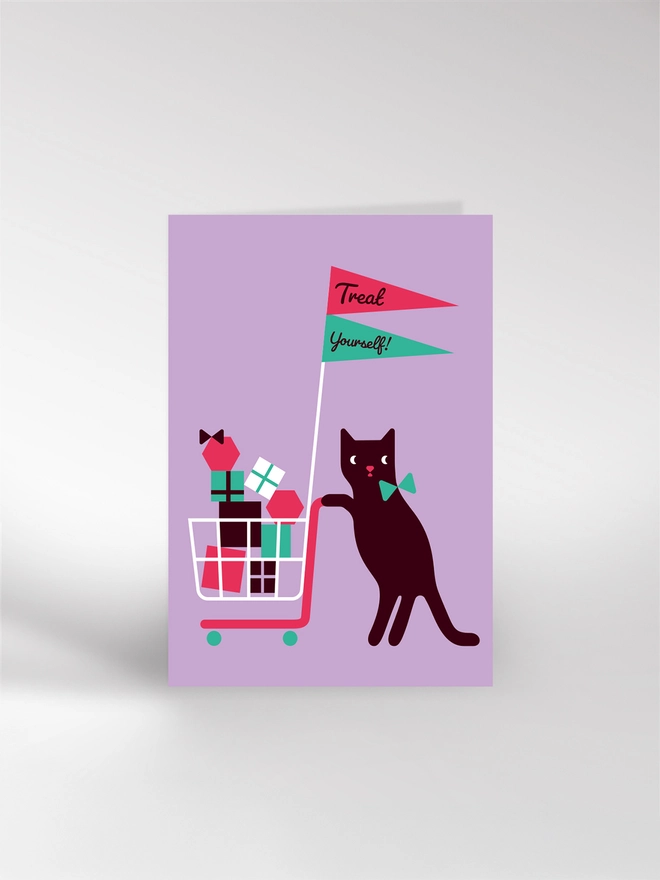 Greetings card featuring an illustration of a cat pushing a shopping trolley full of birthday gifts