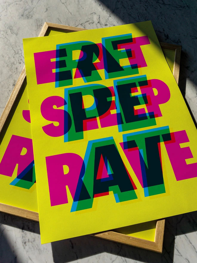 A colourful giclée typographic print with the words "Eat Sleep Rave Repeat" in bright pink, green, blue, and yellow, laid on a wooden frame against a marble surface. An ideal gift for an old raver!