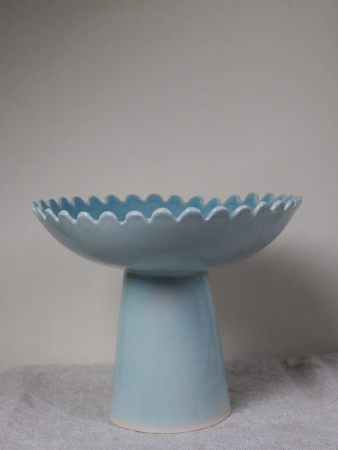 daisy edge pedestal bowl in heaven blue outside and teal inside