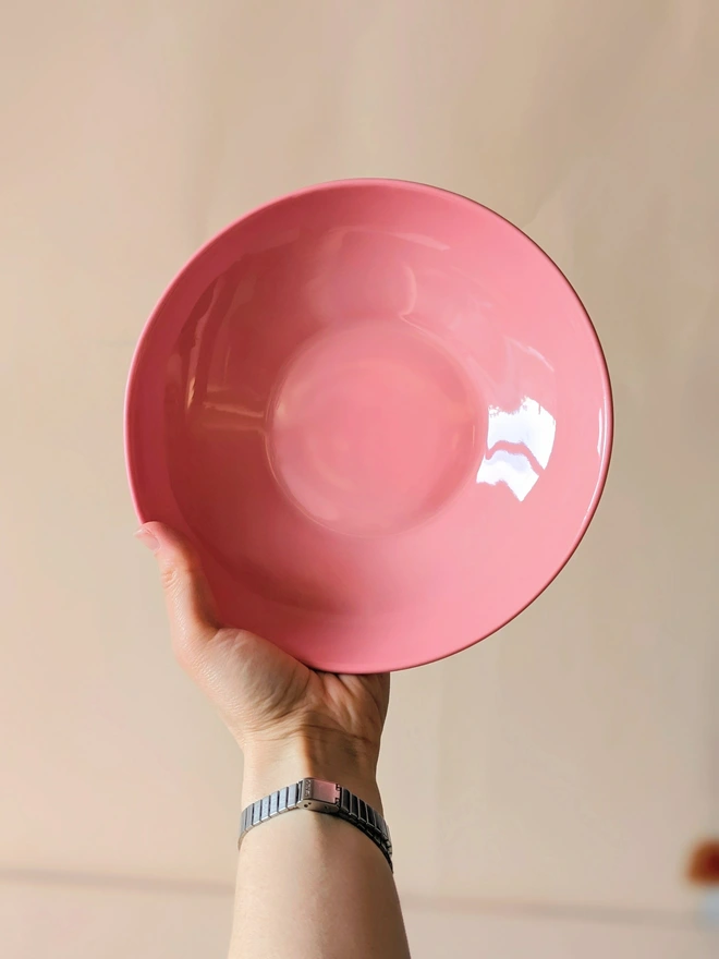 Glossy Glazed Inside of hand made Pasta Bowl in Milkshake Pink Held in Hand