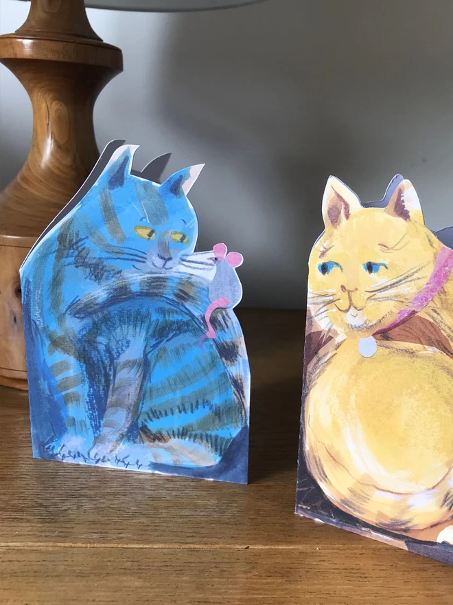 Two cat-shaped. cards in 