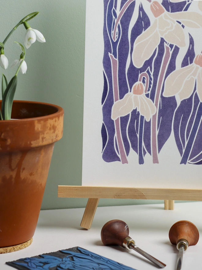 linocut snowdrops in purple, lilac and delicate pink.