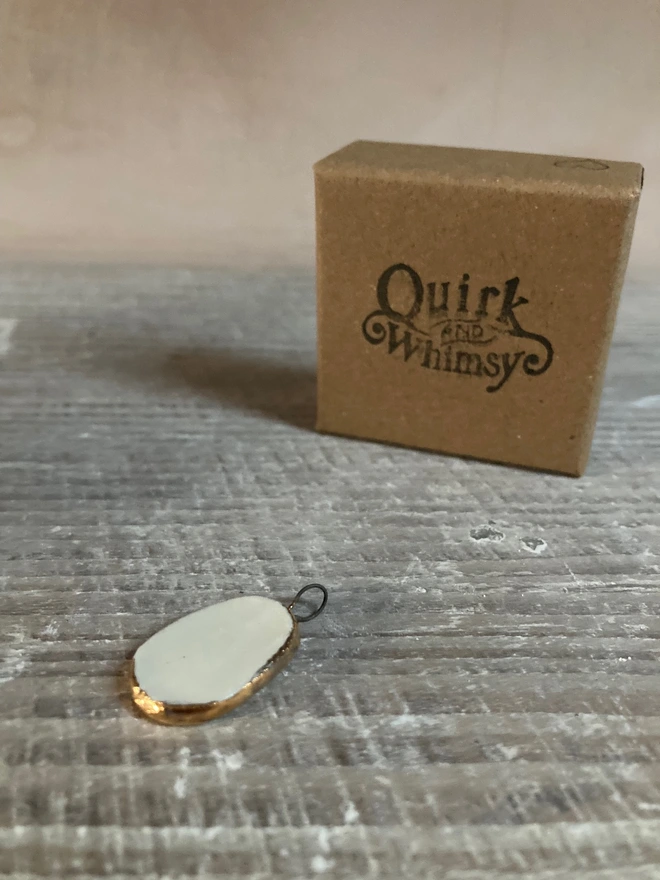 back of pendant and box