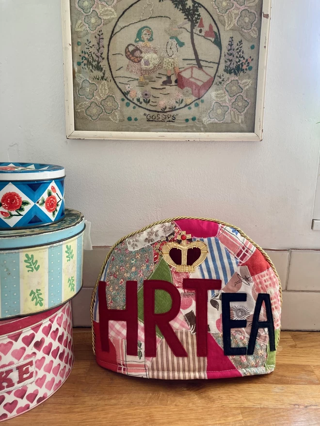A shot of patchwork tea cosy set in a kitchen.