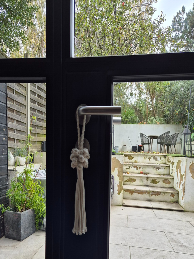 Handmade hanging door tassel with decorative knots with a tasseled end. Adds a sophisticated and elegant accent for all spaces, minimalist, modern and rustic homes