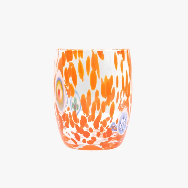 round tumbler glass with orange splotches