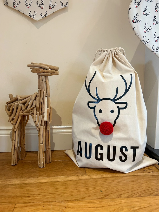 personalised Christmas Sack with Reindeer design an red pom pom nose