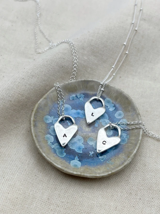 Hand made heart talisman charms made from 100% recycled sterling silver, cute gift for girlfriend or wife for Valentine's Day or Mother's Day. Send straight to your special someone. Made by Celina C Jewellery, a small business in the UK, find on Holly and Co.