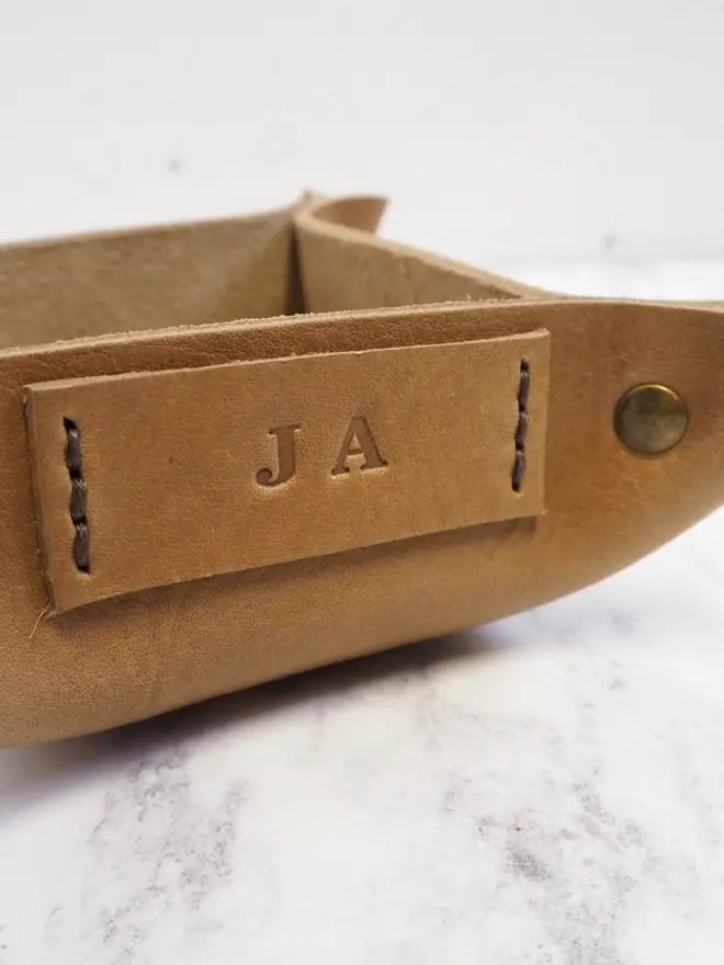 personalised tag on a mini leather jewellery tray