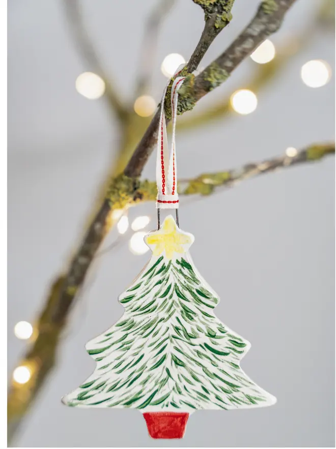 Ceramic Christmas tree with green branches, red pot and yellow star
