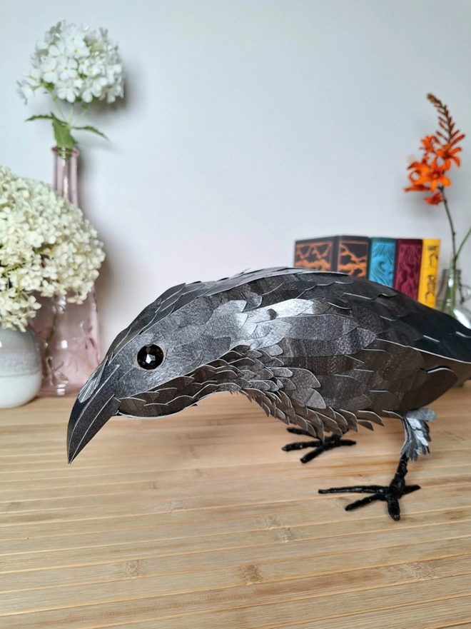 Handmade paper sculpture of a raven