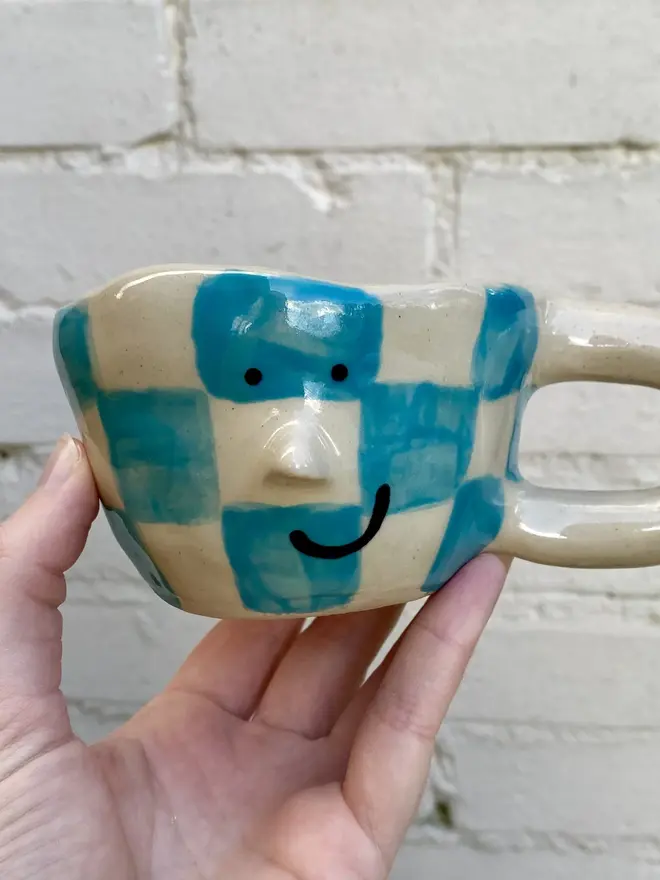 blue white check handmade ceramic smiley face mug