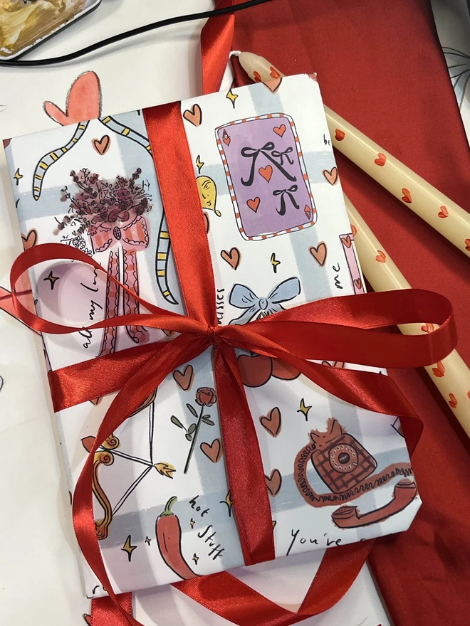 Valentines exclusive gift wrap addition- includes valentine's wrapping paper and a red bow