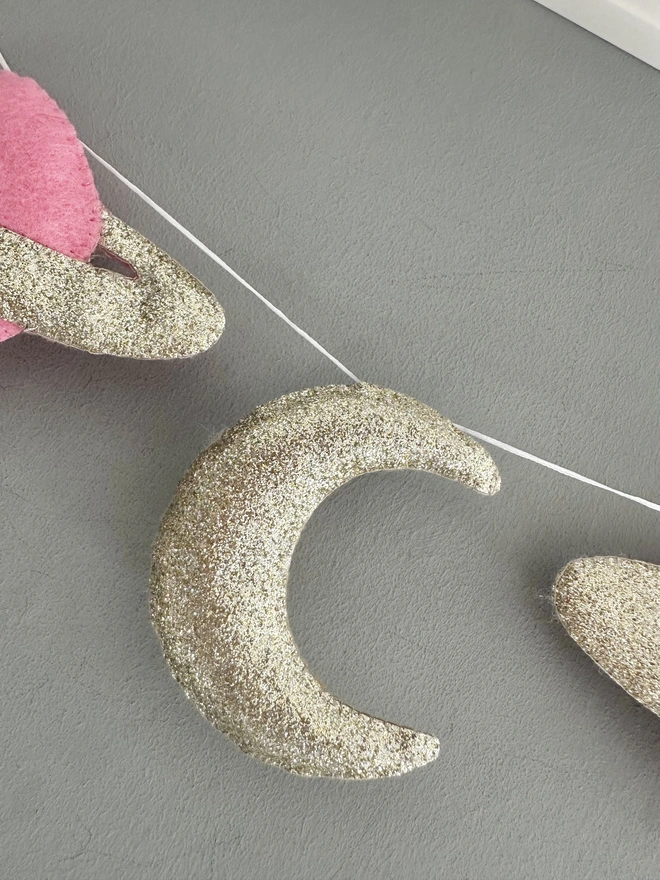 Planet And Stars themed garland hanging in a child’s bedroom, nursery decoration, baby gift 