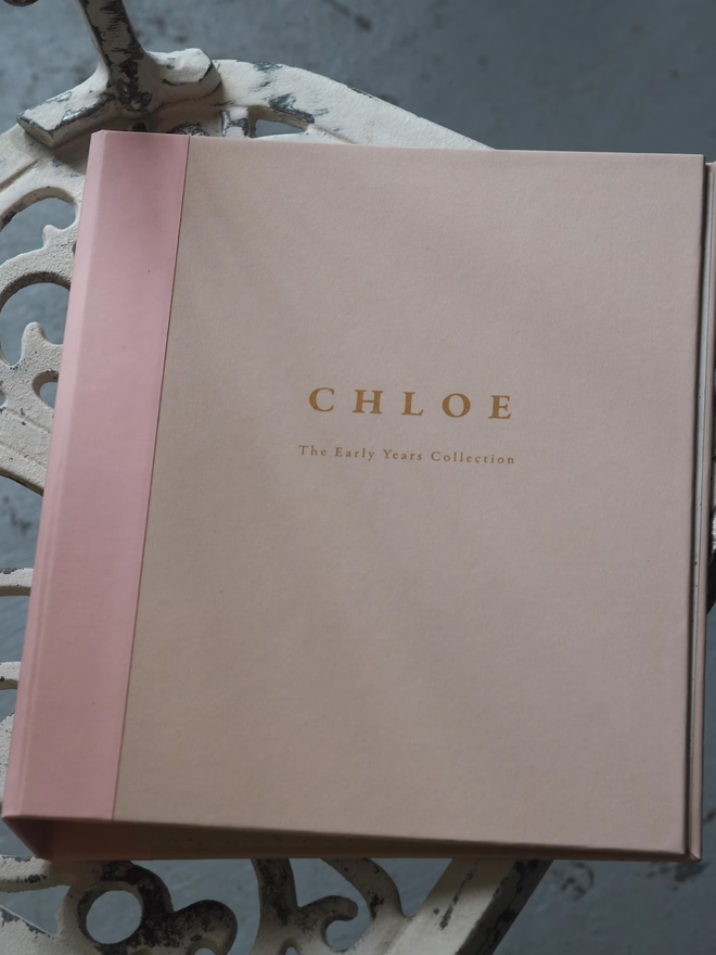 personalised keepsake ring binder. a personalised pink ring binder with a name on the front.