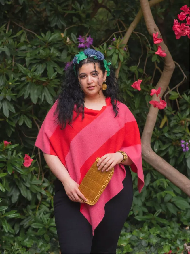 Pink striped poncho worn on model