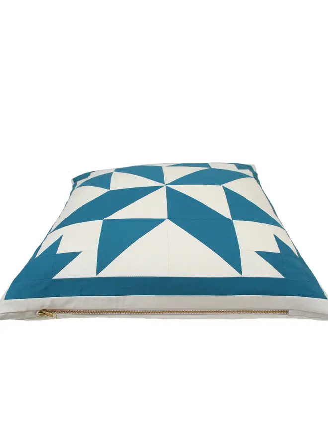 Celest Patchwork Cushion, against a white background. 