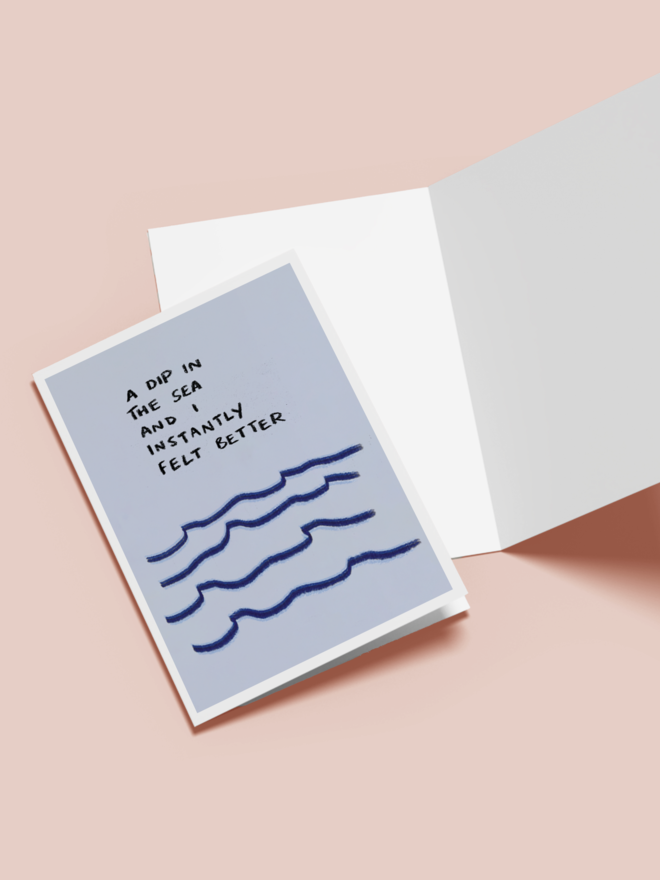 'dip in the sea' card. a blue card with illustrated waves.