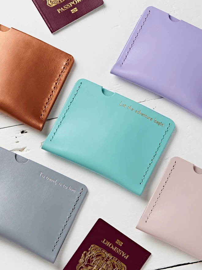 Painted Leather Passport holders, mint, copper, lilac, grey or pink. These can be personalised with gold lettering.