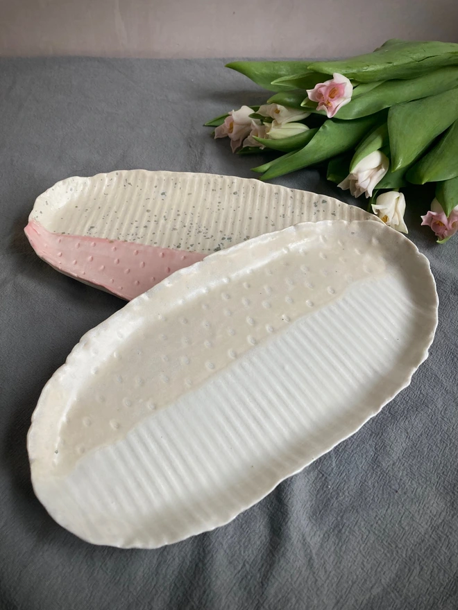 two porcelain platters with flowers