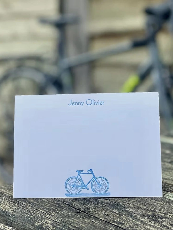 Personalised Bicycle Correspondence Cards (Set Of 10, 20), blue bicycle icon on white correspondence card with name personalisation. 