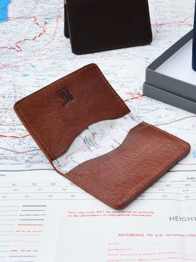 Original Silk Lined Escape Map Leather Card Holder seen on a map.