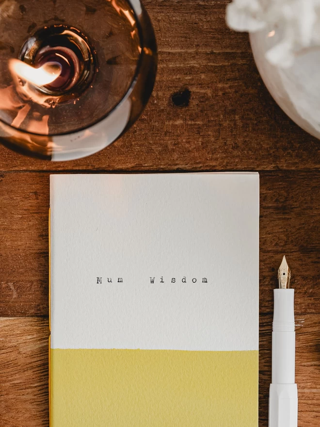 close up of yellow and white notebook