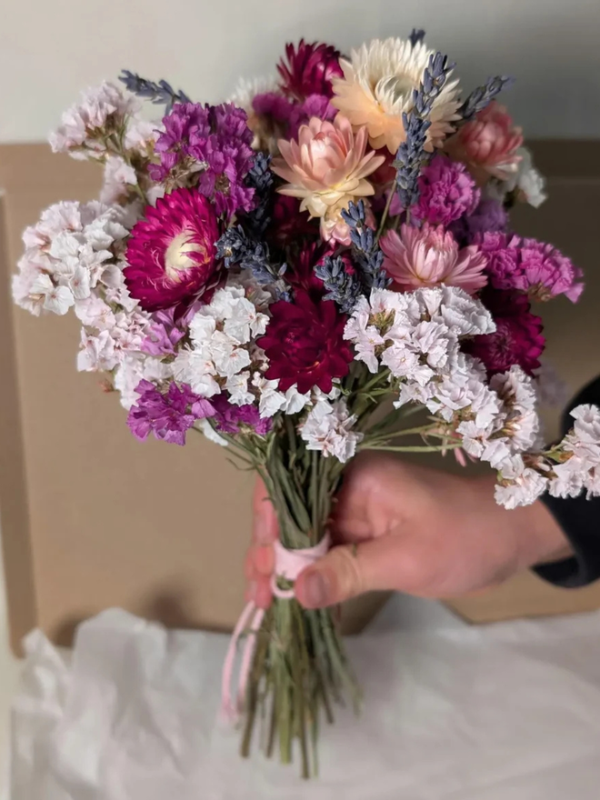 dried flower kit. pink, white and purple dried flower kit assembled into bouquet.