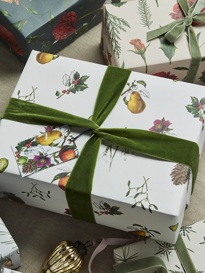 white base spaced out christmas pattern wrap with festive botanical elements 