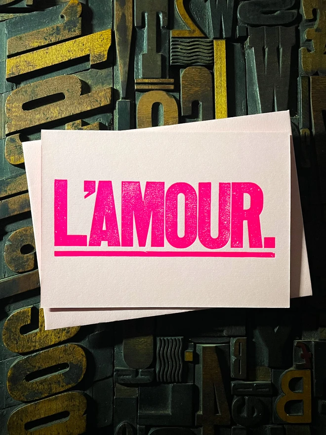 L’Amour! A beautiful wooden type letterpress card printed with rich fluorescent pink ink on thick Candy Pink card with a luxury matching envelope; ideal to send a to a friend or loved one.