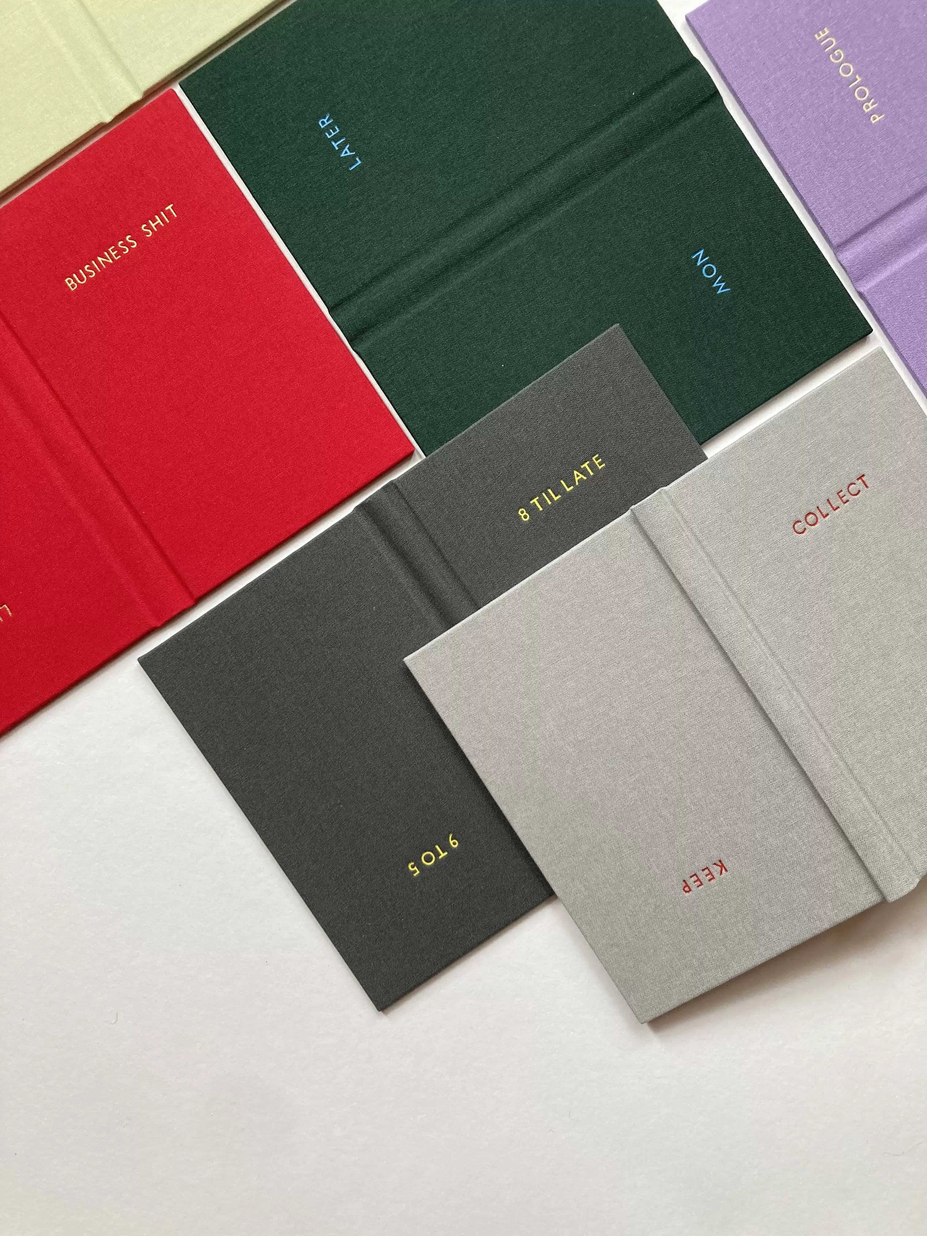 Handmade double fronted pocket sized note books in a variety of colours with bespoke foiled lettering
