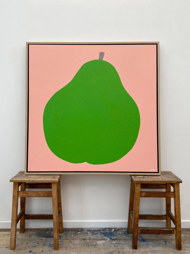 Painting of a giant green pear on pink background leaning on wooden stools