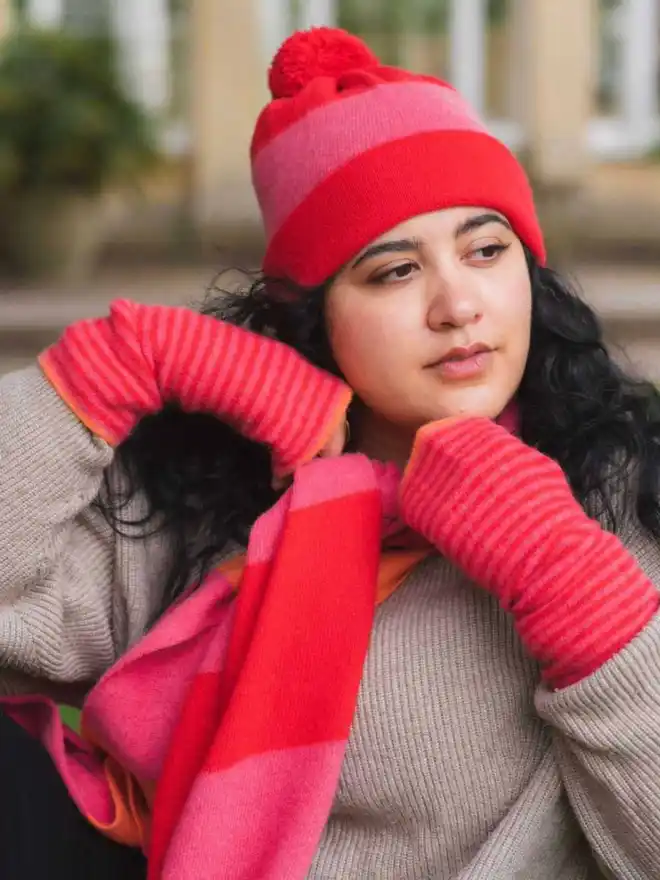 Merino wool red pink Orange scarf worn on model with matching accessories