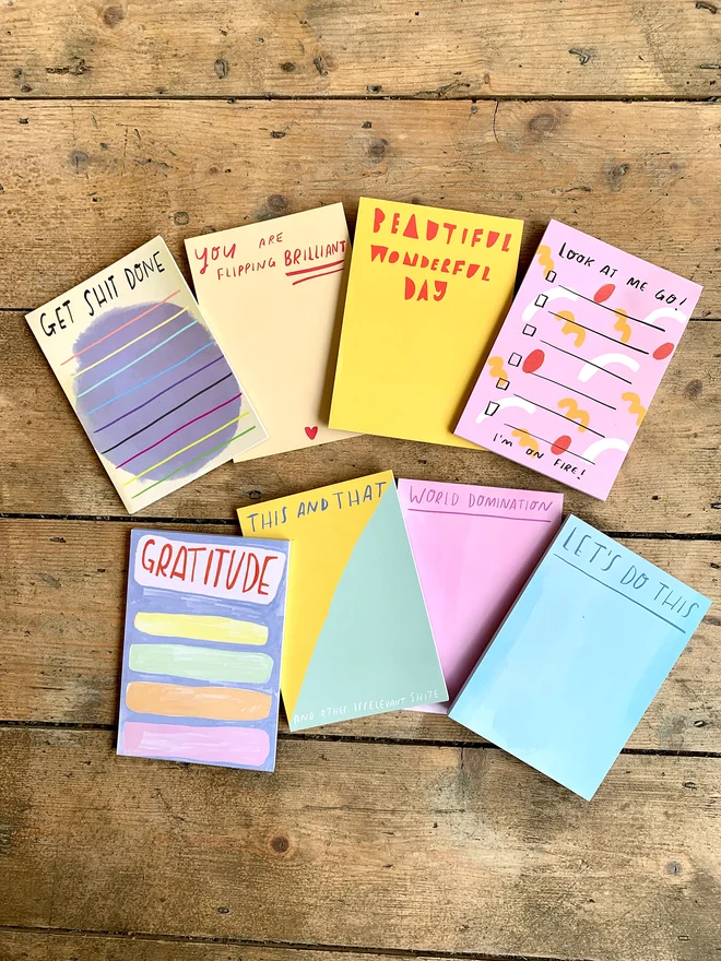 All eight designs of desk jotter