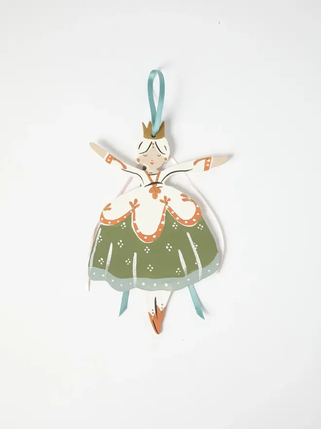 Belle Tree Dancer. wooden hanging ballerina decoration with a gold crown, cream bodice and sage green floral skirt, duck egg blue and pale pink ribbon ties, arms outstretched, on a white background